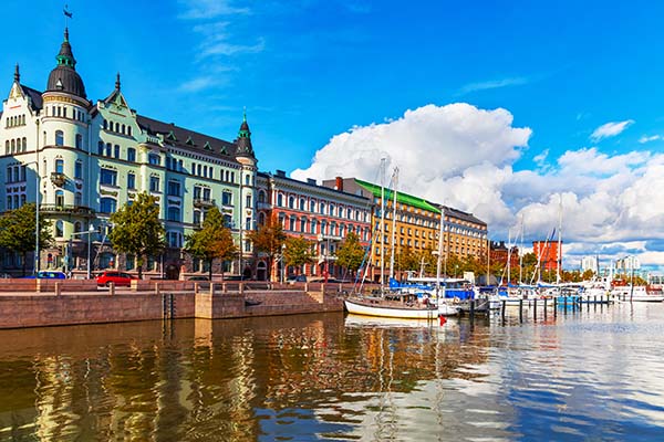 Scenic summer view of the Old Port pier architecture with ships, yachts and other boats in the Old Town of Helsinki, Finland