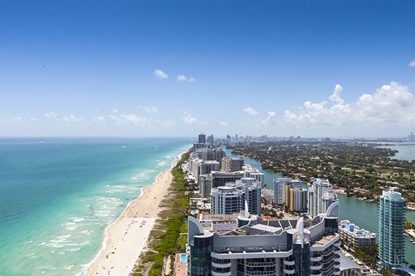 View of Miami facing south from Collins and 63rd with South Beach on the left and the city on the right.