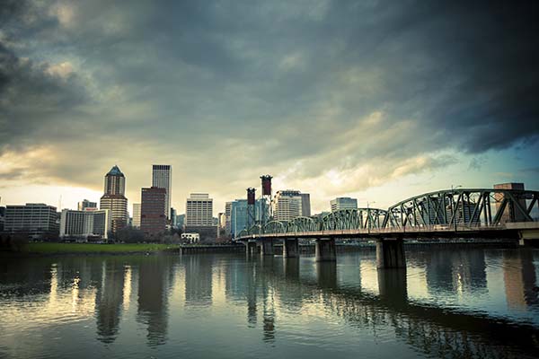 The Hawthorne Bridge crosses the Wilamette River and into the Pearl District, Portland's downtown core.